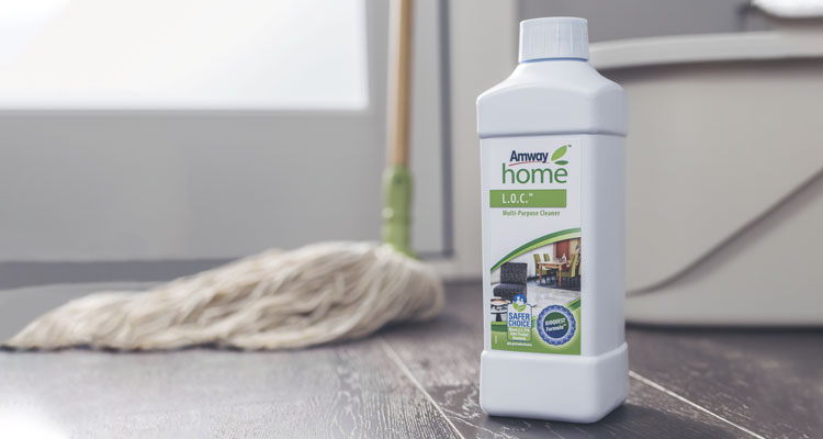 Mood shot of Amway Home L.O.C Multi-Purpose Cleaner with mop in the background 1 